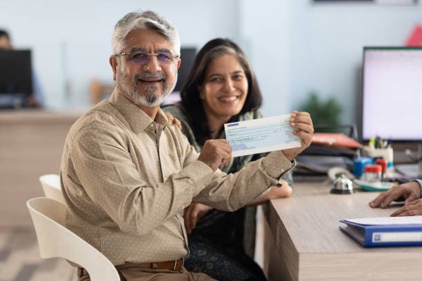 Homeowners smiling after receiving their recovered surplus funds