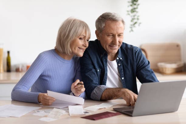 Senior couple reviewing their case details together